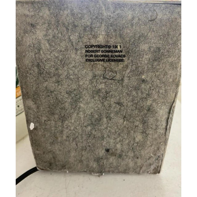 Robert Sonneman for Kovacs Lighting Torchiere floor lamp. White enamel over metal, halogen lighting element with glass...