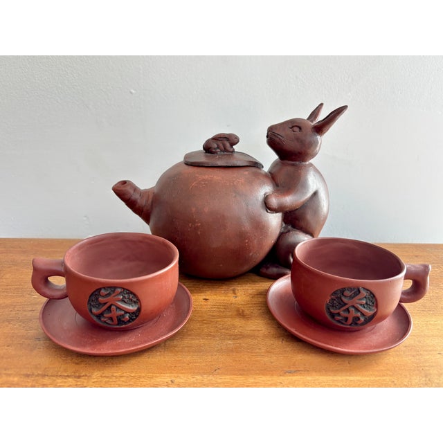 Delightful Chinese Yixing Zisha tea set in naturalistic design in the relief of a rabbit and gourd tea pot and lid of a...