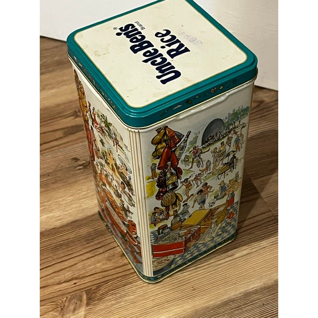 Vintage 1987 Uncle Ben's Rice metal collectible storage tin featuring a colorful Hawaiian fiesta and luau theme.