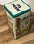 Vintage 1987 Uncle Ben's Rice metal collectible storage tin featuring a colorful Hawaiian fiesta and luau theme.