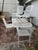 VINTAGE WROUGHT IRON PATIO DINING SET WITH TABLE AND SIX CHAIRS | A classic vintage wrought iron outdoor dining set...