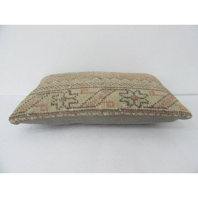 Decorative pillow cover made from a vintage Turkish handknotted rug. Backed with good quality cotton fabric. Pillow...