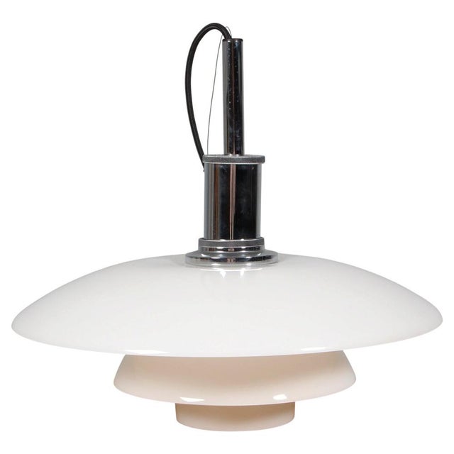 Poul Henningsen pendant lamp in chrome and opal glass. Model 4½/4, made by Louis Poulsen. This piece is attributed to the...