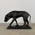Finely cast bronze sculpture depicting a hunting hound in motion, head lowered in a tracking posture. The piece conveys a...