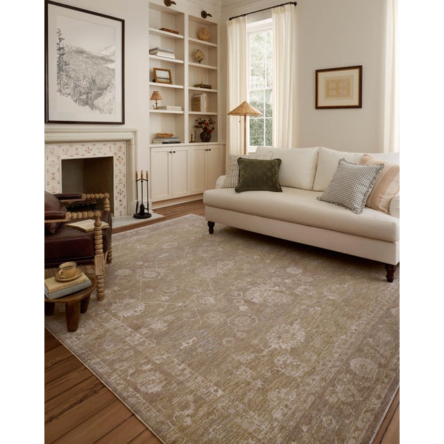 The Louisa Collection is a serene area rug based on beautiful, traditional Turkish designs updated in calm colorways by...