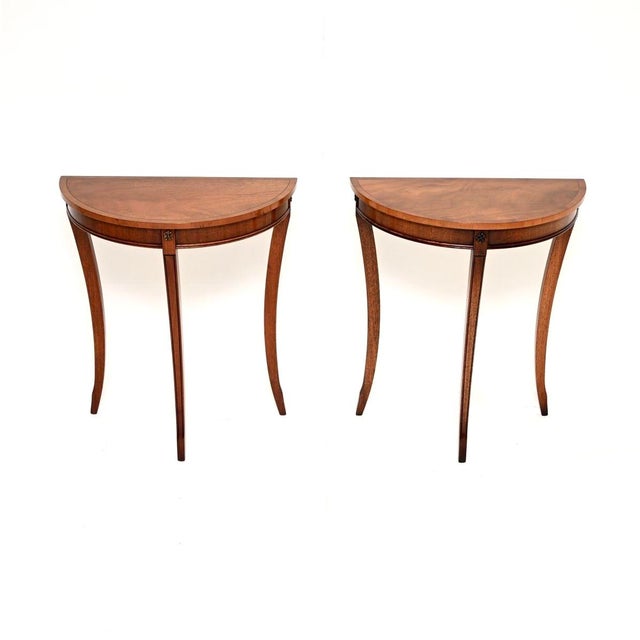 A beautiful and elegant pair of antique Regency style console tables. They were made in England, and date from around the...