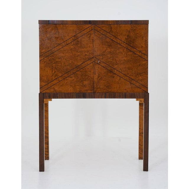 Stunning cabinet manufactured in Sweden, 1930s. This cabinet is a great example of the golden age of Swedish furniture,...