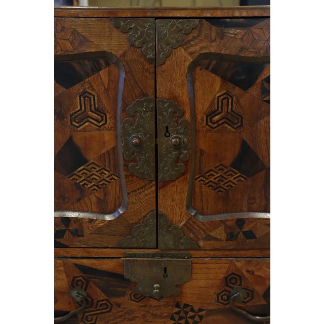 Brown Wonderful Raised Japanese Cabinet Crafted With Geometrically Intricate Inlayed Wood and Hand Wrought Hardware For Sale - Image 8 of 12