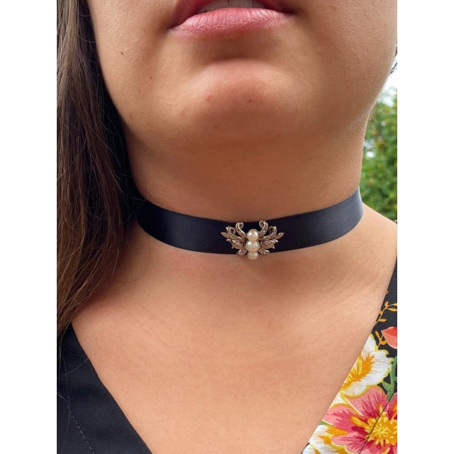 The Erica Antique Pearl and Diamond Pendant/Pin Combination. Choker on Ribbon Currently Crafted in 14 karat white gold and...