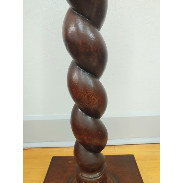 Here's a beautiful English oak plant or candle stand from the late 19th Century. It retains its original finish, which has...