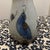 Add a touch of rustic charm and cultural artistry to your space with this beautiful Mexican pottery bud vase. Featuring a...