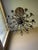 Large dramatic crystal entry chandelier with antique bronze/gold finish and multiple tiers of faceted hanging crystals....