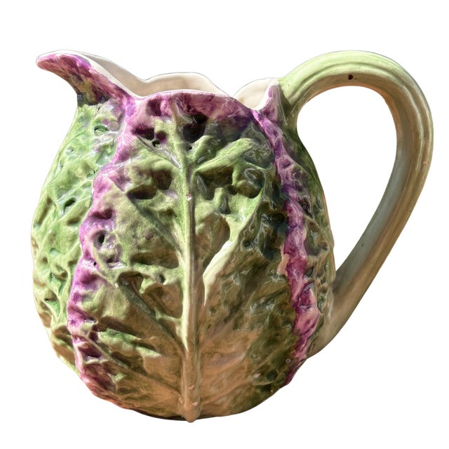 A delightful antique french majolica pitcher, beautifully modelled as a lush cabbage with gracefully layered leaves...