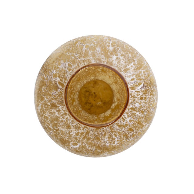 A radiant burst of sunshine replicated in a bright amber hue. This vase captures the molten layers of the sun with its...