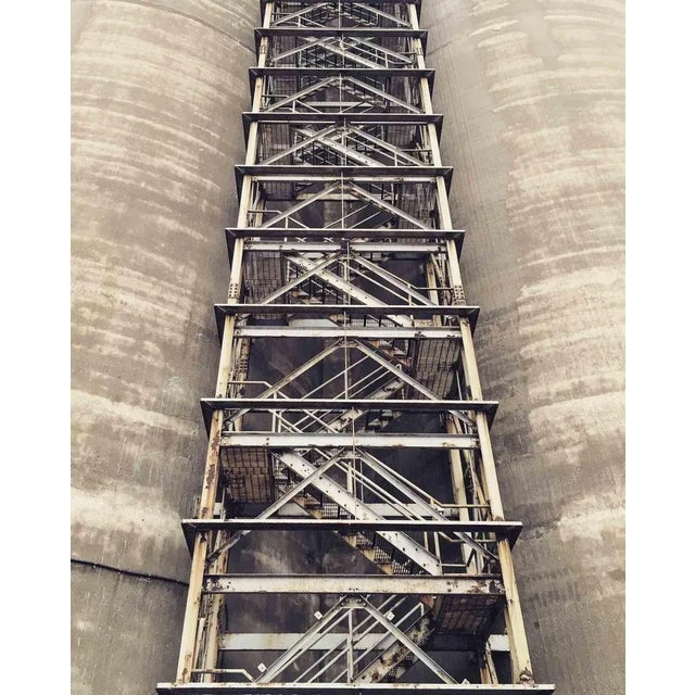 Industrial Look Up is a mesmerizing photograph on Pearl photographic paper realized by the artist Cindi Emond in 2015....