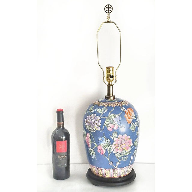 Offering a restored Chinese porcelain hand painted table Lamp with heavy textured glaze, circa Mid 20th Century. The...