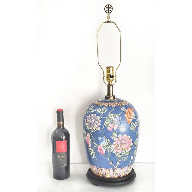 Offering a restored Chinese porcelain hand painted table Lamp with heavy textured glaze, circa Mid 20th Century. The...