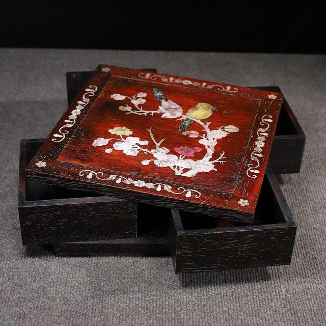 This is an exquisitely crafted wooden storage box featuring a unique swivel top mechanism and intricate mother-of-pearl...
