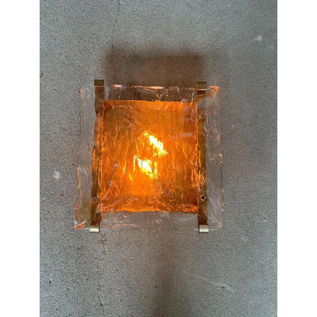 A beautiful collection of Italian wall sconces dating from the 1970s, featuring thick hand-textured Murano glass shades...