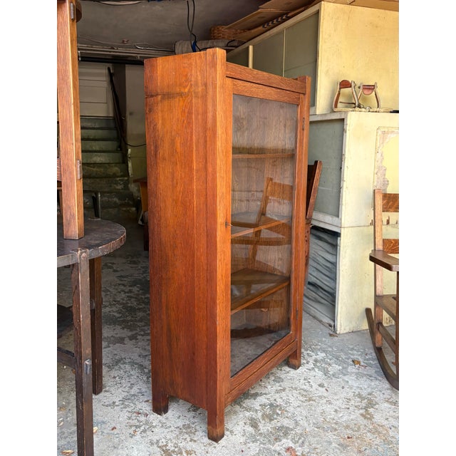 Charming and useful single door cabinet with 3 adjustable shelves, great for displaying pottery or books!