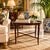 Elegant vintage faux-bamboo carved wood side table featuring an oval tray-style top with a raised molded border and a rich...