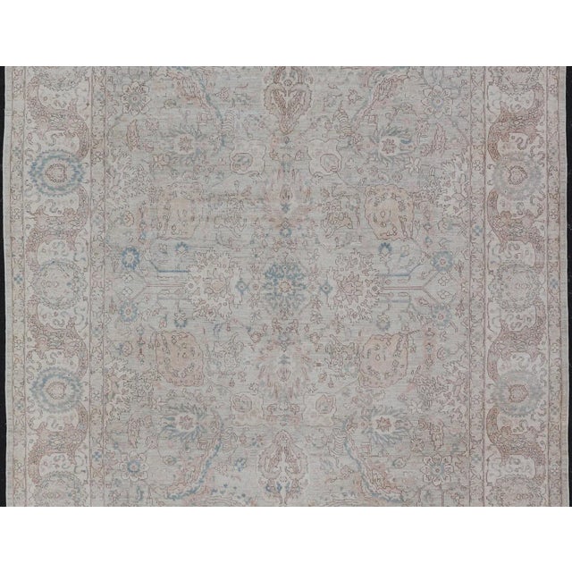 Measures: 9'3 x 13'7 Finely woven Mohtasham Kashan Design in Soft Tan, Taupe, Light Blue, and Ivory 9'3 x 13'7 Keivan...