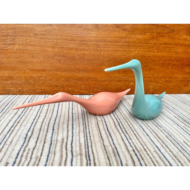 A striking pair of postmodern Pink and Teal ceramic Birds sculptures by Jaru Art Pottery of California. Dated 1985 Feature...