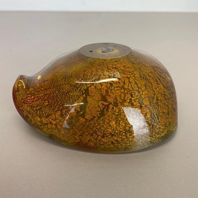 This original glass shell bowl was produced in the 1960s in Murano, Italy. An elegant muticolor Murano glass element...