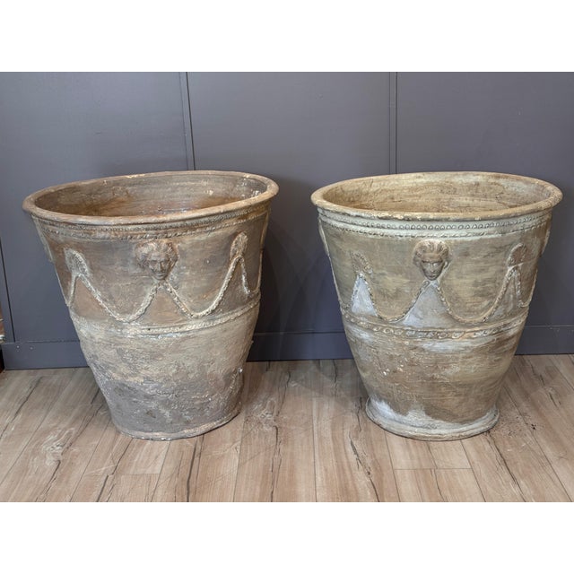 Pair of 19th C Neapolitan terracotta garden pots, each of tapering circular form with a rolled rim above a guilloche band,...