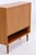 Vintage bar cabinet from the 1960s with a well-designed interior. Behind the flap are a mirror, a glass shelf, and a...