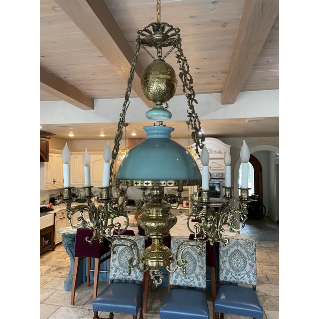 This gorgeous chandelier was imported from France. Originally it was an oil lamp but has been wired to meet all USA...