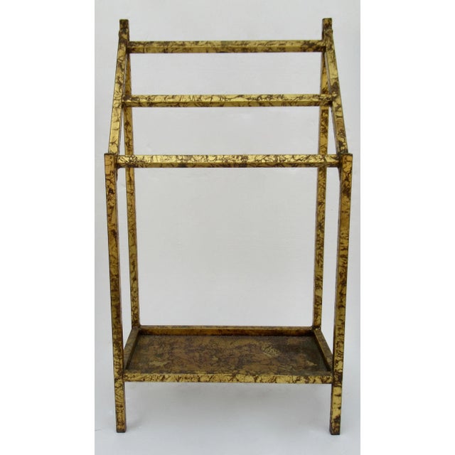 Vintage: Hollywood Regency gilt metal tiered towel rack holder. There is a recessed base interior, of a pierced fretted...