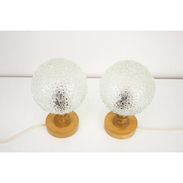 Vintage set of two table lamps from the 1970's, made in Hungary. Made of plastic, glass and wood. Fully functional, in...