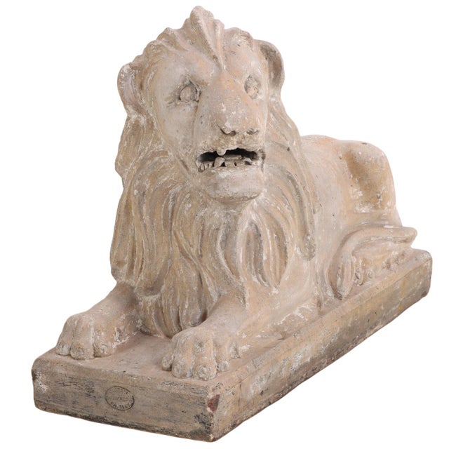 A distinguished pair of Scottish terracotta recumbent lions, modeled in a naturalistic manner with finely rendered manes,...
