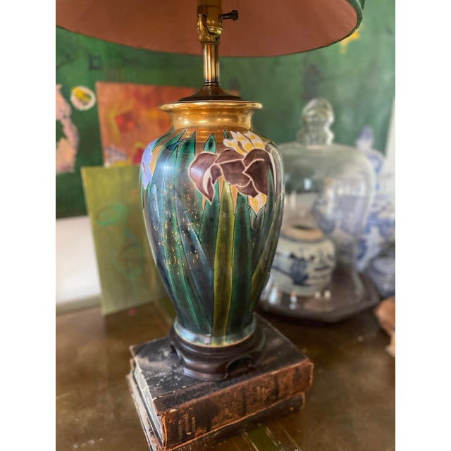 This gorgeous and uniquely detailed enamel painted ceramic table lamp has been crafted with an Asian influence. A Ming...