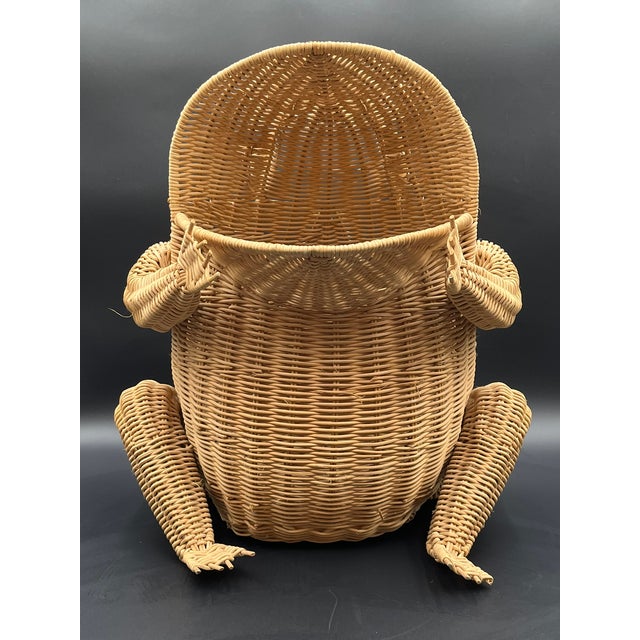 This unique, handmade storage basket in the shape of a sitting frog combines humorous design with traditional weaving. The...