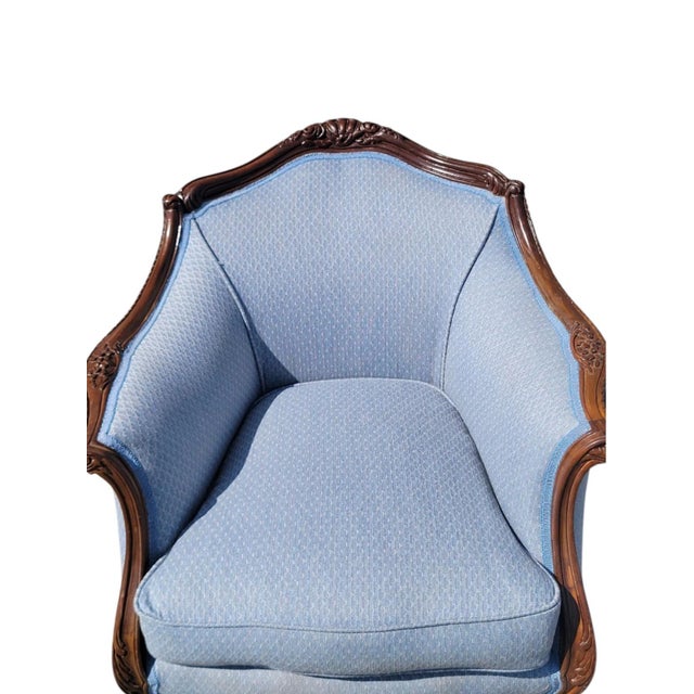 The 1930 Club Living Room Chair is a fully assembled, antique chair in a solid sky blue color. This indoor chair,...