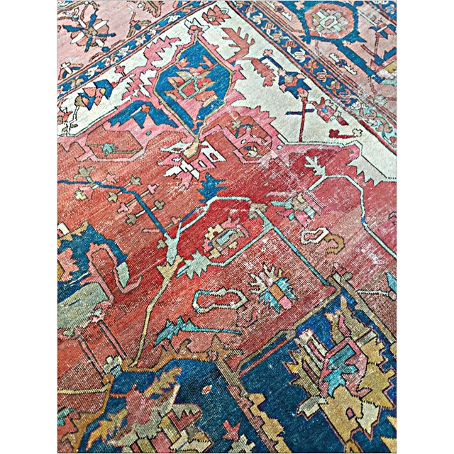 Antique Persian Serapi rug featuring a striking large central geometric medallion set against a muted rust field. Hand-...