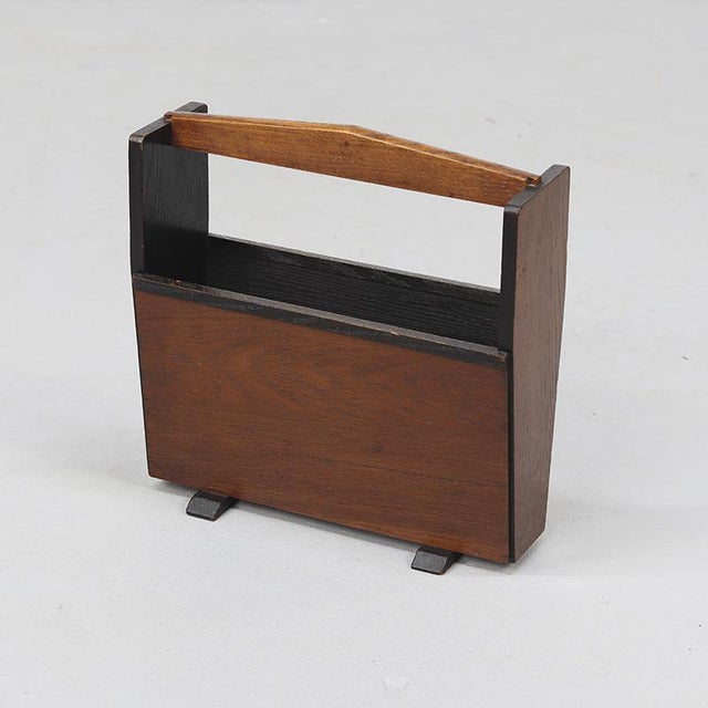 A unique, exclusive Art Deco magazine rack made of solid oak with oak veneer. Beautiful black accents on the inside...