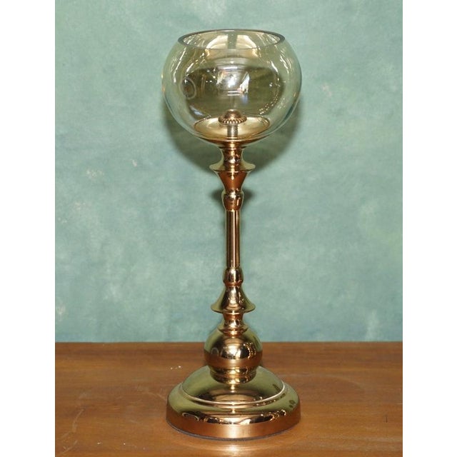 Stylish set of four modern decorative candle holders, beautifully made with polished brass-finished frames and substantial...