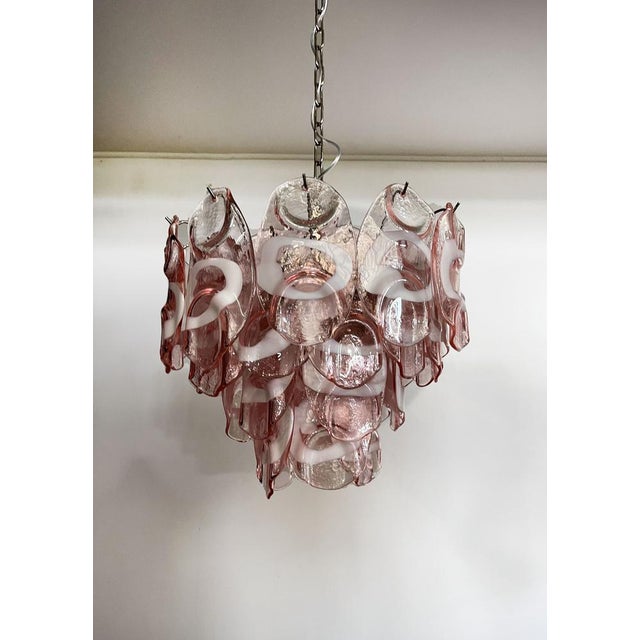 Vintage Italian Murano chandelier in Vistosi style. The chandelier has 36 fantastic Murano white and pink glasses...