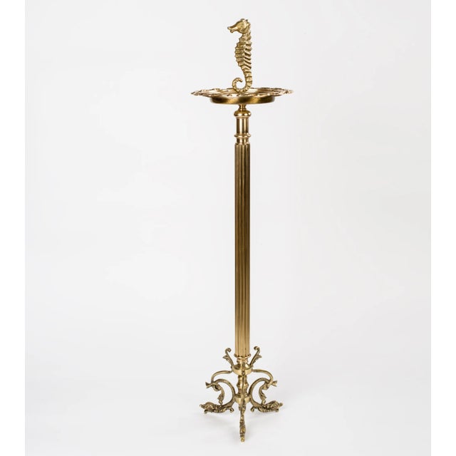 A vintage ornate brass ashtray with top handle in the shape of a seahorse and base with fishes, Spain 1960s. Measures:...