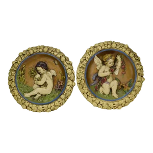 Pair Mid 20th Century Signed Round Porcelain Style Scenic Cherub Wall Plaques in Relief