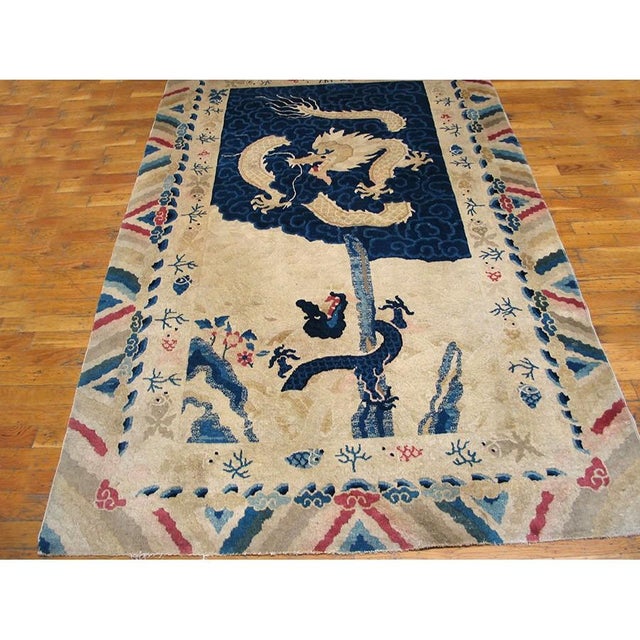 Antique Chinese - Peking Small Scatter Size Wool Ivory Rug, Circa Date: 1900s. This exceptional Peking weaving captures...