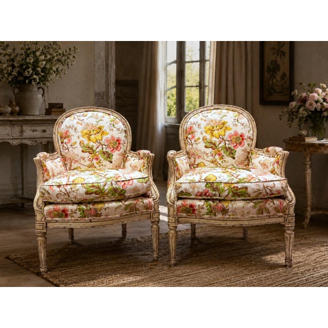 A beautiful pair of Yale R. Burge Bergère armchairs with classic French-inspired lines and a wonderfully decorative...