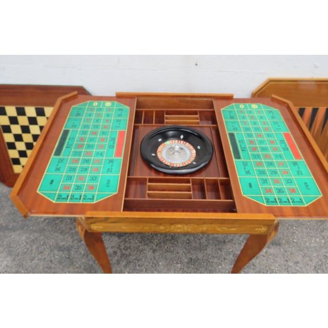 This Game Table is made of wood, solid wood, and veneer. This wonderful table has a Italian style and design: it features...