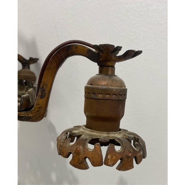 The chandelier features floral and shield motifs, gothic revival, very heavy - brass and bronze 18” diameter 21” tall 14”...