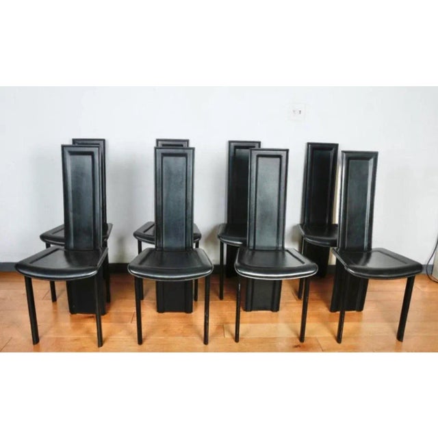 Well kept Italian black leather Highback dining chairs. No rips or tears on leather. Nice Italian design. Sturdy and strong.