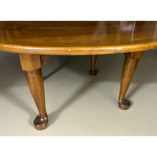 Late 1950s Stickley cherry Queen Anne style round coffee table with separate polished granite top. The table measures 38"...