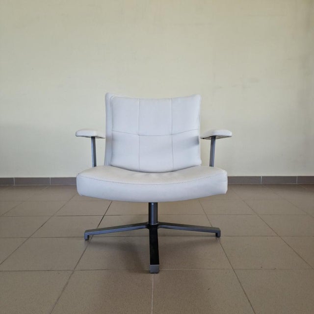 Elegant armchair in Art Deco style, upholstered with high-quality natural calfskin in stylish white color. The armchair is...